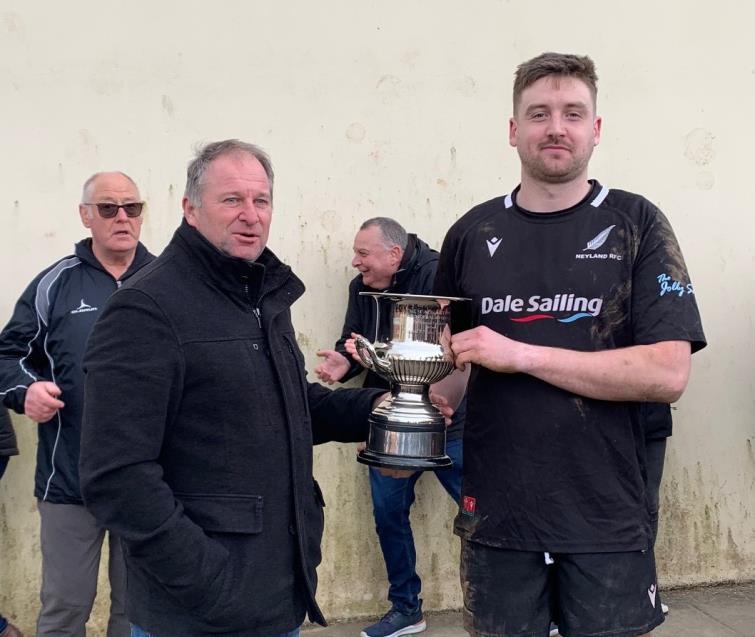 Phil Sutton presents George Williams with the Sutton Cup